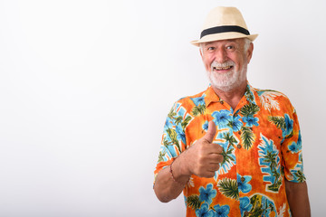Happy senior bearded tourist man smiling while giving thumb up
