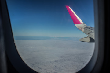 air plane concept shot view to plain wing through low cost window 