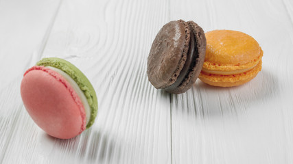 French macrons on white wooden table