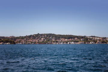 View of Bosphorus and european side in a sunny summer day in Istanbul. Image is captured neighborhood called Kanlica / Beykoz in Asian side.