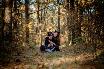 Halloween vampire and witch in the woods