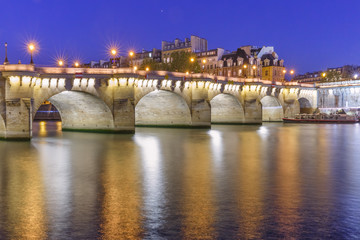 Fototapeta na wymiar Night view of Ile de la Cite and Pont Neuf in Paris, France