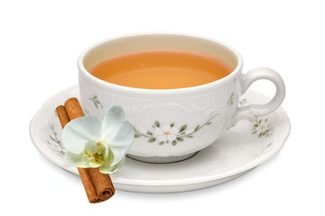 Herbal tea in porcelain cup with leaves isolated on white background 