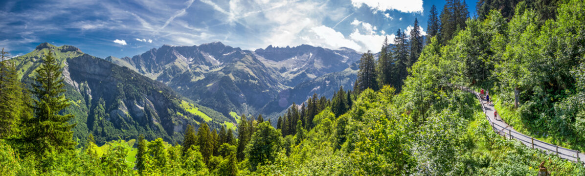 View of Elm village and Swiss mountains - Piz Segnas, Piz Sardona, Laaxer Stockli from Ampachli, Glarus, Switzerland, Europe