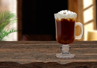 Irish coffee on wooden table at cafe