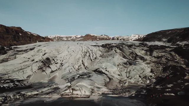 Iceland landscape of glacier Solheimajokull glacier. Beautiful nature aerial drone video of Icelandic nature. Tourist destination and attraction on South Iceland. Glacial lake / lagoon.