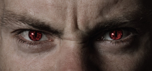 Red angry devil eyes closeup - 229082018