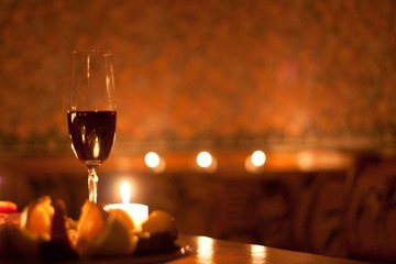 Red wine and candles - romantic evening.