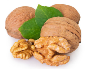 Walnut with leaf on white background