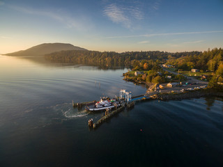 Pacific Northwest Ferry Boat Docked During Sunrise. Aerial view of the Lummi Island ferry, "Whatcom Chief", at home during a glorious autumn sunrise.