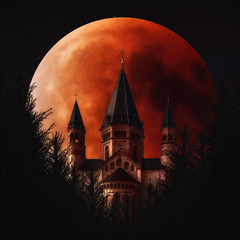 Blood moon and Mainzer Doom, Mainz, Germany. Full Lunar Eclipse in the night sky, fantasy image...