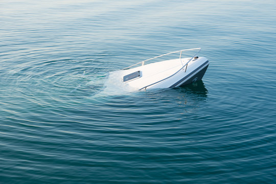 Sinking modern large white boat goes underwater
