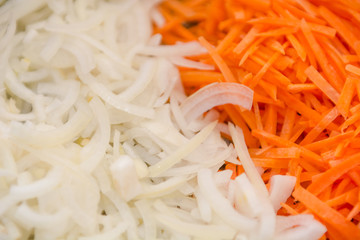 Background onions carrots. The texture of onions and carrots. Sliced onions and carrots.