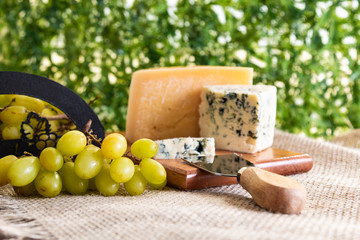 wine table with cheese and grapes