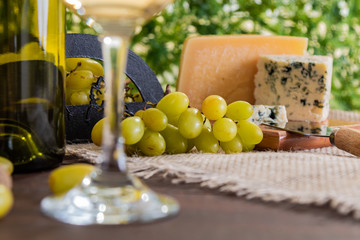 wine table with cheese and grapes