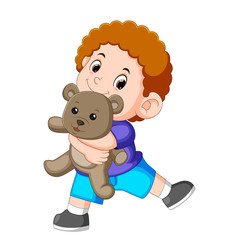 a boy happy play with the grey teddy bear