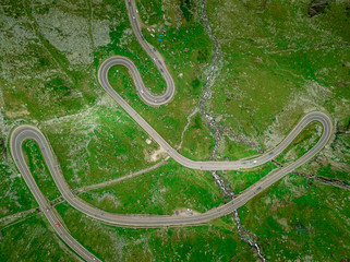Aerial view of Balea lake and curving road of the Transfagaras pass in Romania