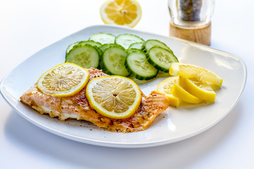 Baked Salmon with Sliced Lemons and Cucumbers