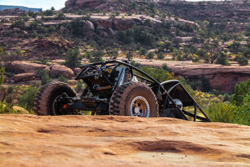 A Custom 4x4 Rock Crawler Off-Roading In The Sandstone Red Rock Terrain Outside Of Moab Utah In The American Southwest © SIX60SIX
