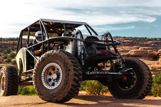 A Custom 4x4 Rock Crawler Off-Roading In The Sandstone Red Rock Terrain Outside Of Moab Utah In The American Southwest