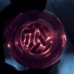 medicine capsules inside bottle with illuminated bottom and dark background ideal for medication medical clinic ads treatments morning pills or health related background