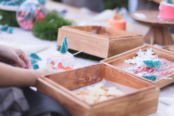 Asian woman prepare the homemade Christmas Vintage Light Cupcake to be some gift for someone