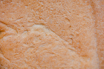 The texture of the crust of bread. Hot fresh bread. Bread close up.
