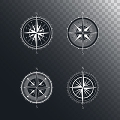 Vector set of vintage compasses or marine wind roses. Collection in line art style. Isolated on dark transparent background. Withe line collection with the basic directions North and South.