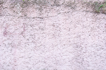 Rose color plaster on the wall closeup texture background, cement surface on the wall