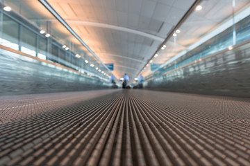 The quick walkway in the airport terminal