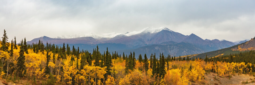 Alaska mountains landscape nature background in autumn fall season. Snow peaks banner panorama.