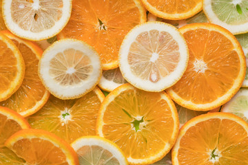 Pattern of juicy ripe slices oranges and lemon. Fruit minimal concept. Flat lay.