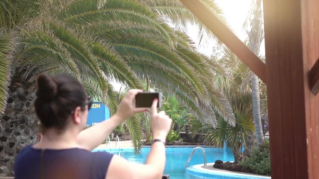Woman taking a picture on the vacation in slow motion 120fps