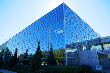 close up on modern company building exterior with blue glass