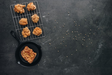 Chicken karaage japanese food in the tray on grey concrete background with herb and flour