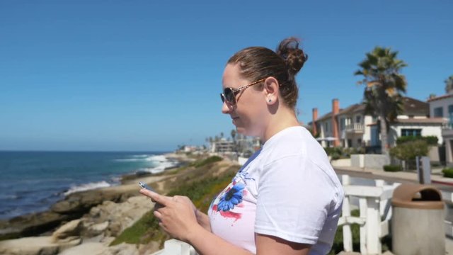 Woman using a smartphone in 4k