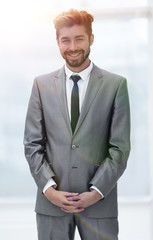 A young man in a gray suit