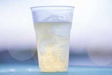 The background of ice cold water and soft drinks (soft drinks, beer, liqueurs, drinking water) has the vapor dispersed around the glass, a beautiful one, the colorful wallpapers of bubbles.