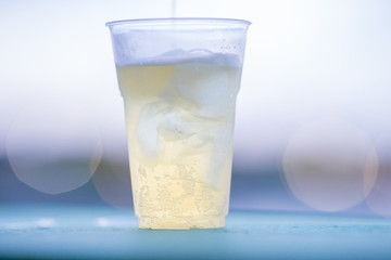 The background of ice cold water and soft drinks (soft drinks, beer, liqueurs, drinking water) has the vapor dispersed around the glass, a beautiful one, the colorful wallpapers of bubbles.