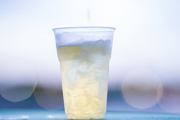 The background of ice cold water and soft drinks (soft drinks, beer, liqueurs, drinking water) has the vapor dispersed around the glass, a beautiful one, the colorful wallpapers of bubbles.