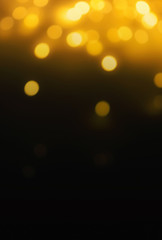  Golden  Christmas bokeh lights on dark Background.  Abstract Yellow  glowing efocused lights, copyspace