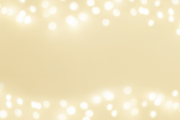 Abstract Golden Christmas Winter Background with festive glowing bokeh lights, copyspace