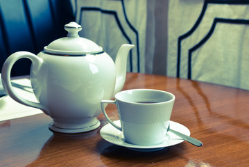 Dining table with tea and teapot - vintage