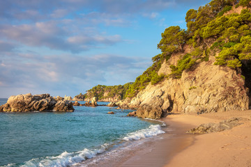 Fototapeta na wymiar Beautiful spanish beach in Lloret de Mar. Cala de Boadella platja