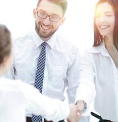 young business woman shaking hands with a colleague