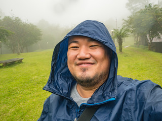 Selfie Photo of Asian fat trekker trekking to Khao Luang mountain Ramkhamhaeng National Park in...