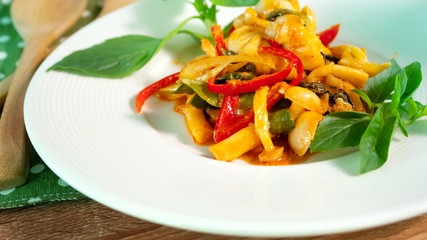 spicy stirred white mushroom and shrimp with red curry and sweet basil , Asian spicy traditional Thai cuisine dish , Asian cooking meal recipe concept