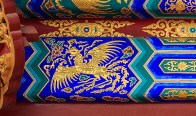 Ornate carved and painted beam with traditional Chinese designs in the Temple of Heaven in Beijing China