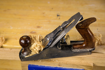 Handplane on a piece of wood with shavings