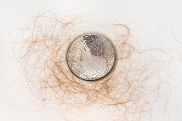 Fototapeta na wymiar Hair loss in bath after shower, clogs in water pipe